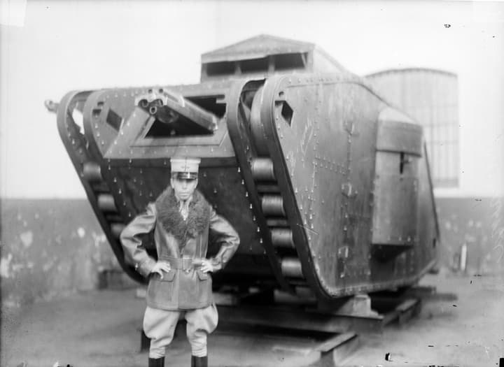 Alberto Salinas Carranza, military aviator, standing beside the TNCA Salinas war tank he designed, c. 1917.